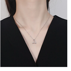 Close-up of a minimalist S925 sterling silver necklace featuring a heart-shaped pendant