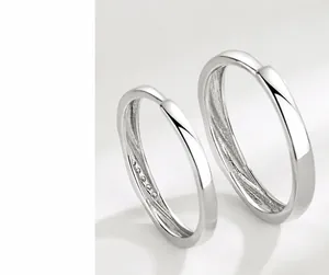 Macro shot of hand-polished S925 sterling silver rings with smooth mirrored surface