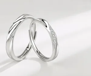 Macro detail of S925 sterling silver couple rings showing twisted band and pave diamonds