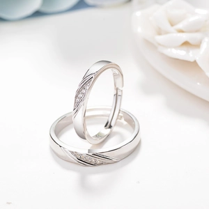 Adjustable S925 sterling silver couple rings with twisted design and cubic zirconia pavé