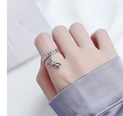Close-up of S925 sterling silver chain ring featuring a dangling rabbit charm detail
