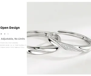 Detail of adjustable open design S925 sterling silver couple rings with wavy texture