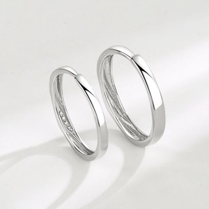 Minimalist S925 sterling silver couple rings with polished finish and pavé accents