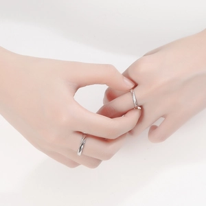 S925 sterling silver couple rings with moebius twist design and small diamond accents