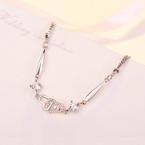 S925 sterling silver interlocking heart bracelet with tiny diamonds and adjustable chain