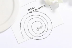 Detailed view of S925 sterling silver snake chain with spring clasp and hallmark engraving
