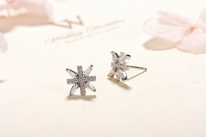Macro shot of S925 sterling silver snowflake earrings with cubic zirconia stones