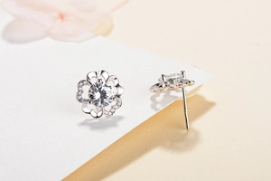 Macro shot of S925 sterling silver plum blossom earrings with brilliant cubic zirconia