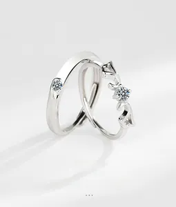 Detail of S925 sterling silver angel wing couple rings with adjustable open band