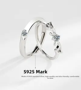 Close-up of S925 sterling silver couple rings with angel wings and adjustable bands