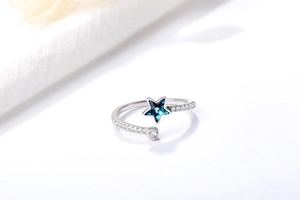Macro detail of S925 silver adjustable star ring with blue crystal and cubic zirconia