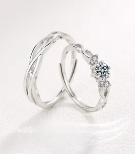Macro detail of S925 sterling silver couple rings with intertwined textures and main diamond