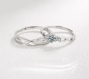 Macro shot of S925 sterling silver couple rings with woven texture and sparkling zircon