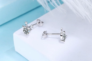 Close-up of S925 sterling silver reindeer antlers earrings with a sparkling round center stone