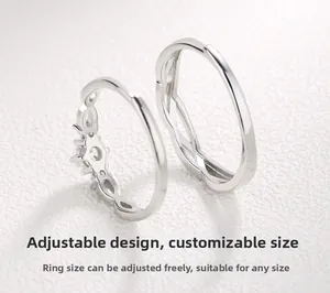 Close-up of adjustable S925 silver couple rings featuring crown and wave textures