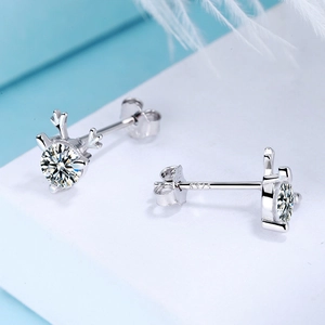 Macro shot of S925 sterling silver reindeer earrings with sparkling zircon gemstones
