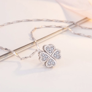 Elegant s999 sterling silver four-leaf clover necklace with sparkling crystal inlay