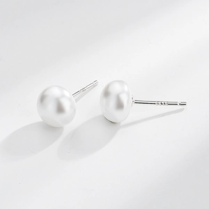 Classic white pearl earrings with silver posts shown on a clean white background