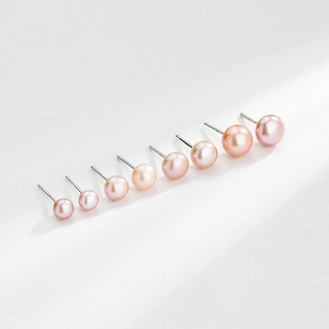 Elegant S999 sterling silver stud earrings with multi-sized natural pearls in soft hues