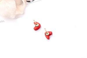 Detailed back view of red heart stud earrings showing gold posts and glossy resin texture