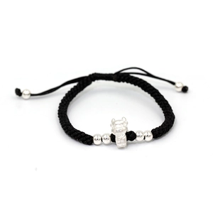 Detail of hand-woven black cord bracelet with S999 silver zodiac ox charm and beads