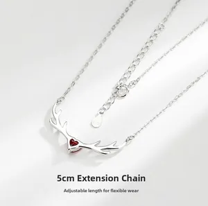 Detailed macro of S925 sterling silver deer antler necklace with red heart stone and 5cm chain
