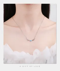 Close-up of S925 sterling silver deer antler necklace with blue heart zircon pendant
