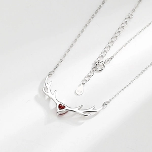 S925 sterling silver reindeer antler necklace with a red heart-shaped gemstone pendant