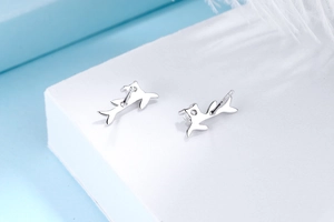 Close-up of S925 sterling silver stud earrings with cat ear design and S925 hallmark