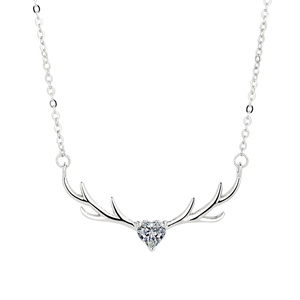 S925 Sterling silver deer antler necklace with heart shaped cubic zirconia on white surface