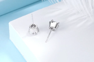 Macro detail of S925 sterling silver stud earring with crown setting and cubic zirconia