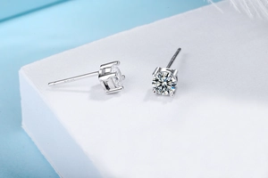 Close-up of S925 sterling silver stud earrings with round-cut sparkling diamonds