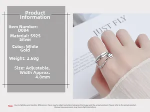 Detail of S925 sterling silver ring featuring Good Luck engraving and a smiley face charm