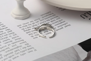Detailed macro view of S925 sterling silver stamp on minimalist chain ring inner band