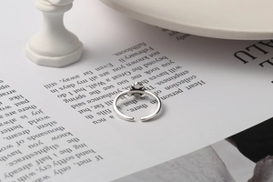 Detail view of S925 sterling silver stamp on vintage cross-style adjustable ring band