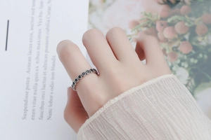 Detail of S925 sterling silver ring with black zircon in vintage minimalist style