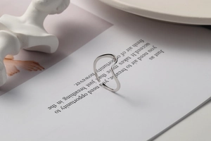 Detail of S925 sterling silver Mobius wave ring showing inner hallmark and minimalist design