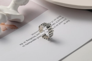 Detailed view of an S925 sterling silver open ring with unique vertical grid bar design