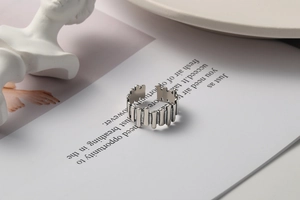 Detailed view of an irregular vintage s925 silver ring on a minimalist background