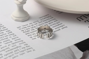 Close-up of S925 sterling silver open ring with irregular castle edge design