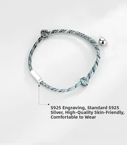 Macro shot of S925 sterling silver stamp on the braided couple bracelet with magnetic charm