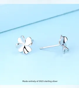 Macro shot of polished S925 sterling silver four-leaf clover stud with purity hallmark