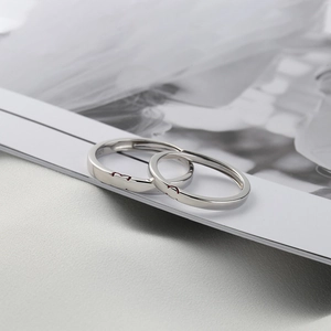S925 sterling silver matching couple rings with red heart pattern on white magazine