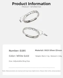 Detailed view of S925 sterling silver couple rings with chain texture and cubic zirconia