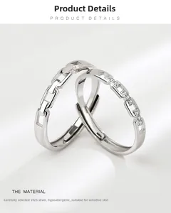 Detail of S925 sterling silver interlocking rings with white zircon stones and adjustable band