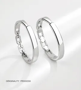 Detailed close-up of S925 sterling silver interlocking couple rings with chain design