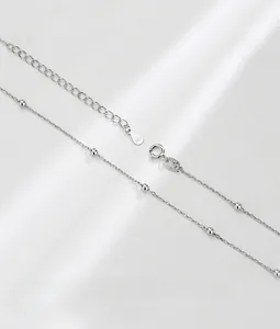 Detailed close-up of S925 sterling silver choker chain with small beads and lobster clasp