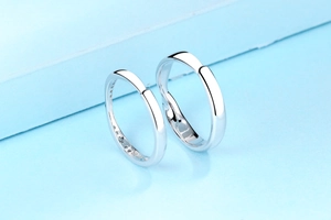 Detailed macro of S925 sterling silver Mobius rings with diamond inlay and polished finish