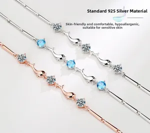 Detail of S925 silver dolphin bracelets with blue and white zircon stones