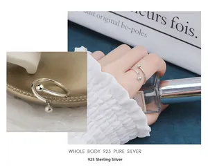 Macro detail of S925 sterling silver ring featuring a double bead wrap design with high polish